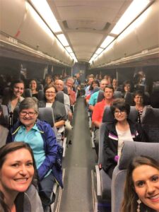 Coach bus taking group to next destination