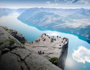 People standing on Preikestolen mountain in Lysefjorden in Fjord Norway