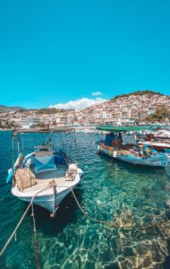 white and blue boat on sea during daytime