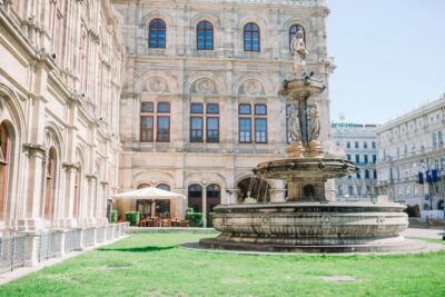 Vienna Opera house, Austria. Photo view on fountain at vienna opera state house