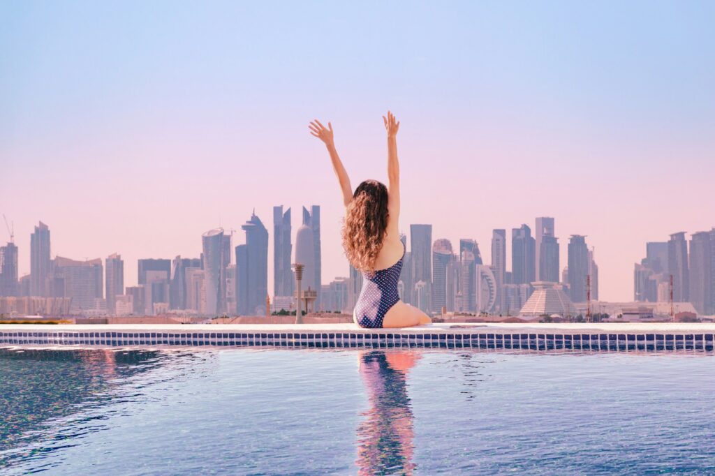 Woman at infinity pool on roof top