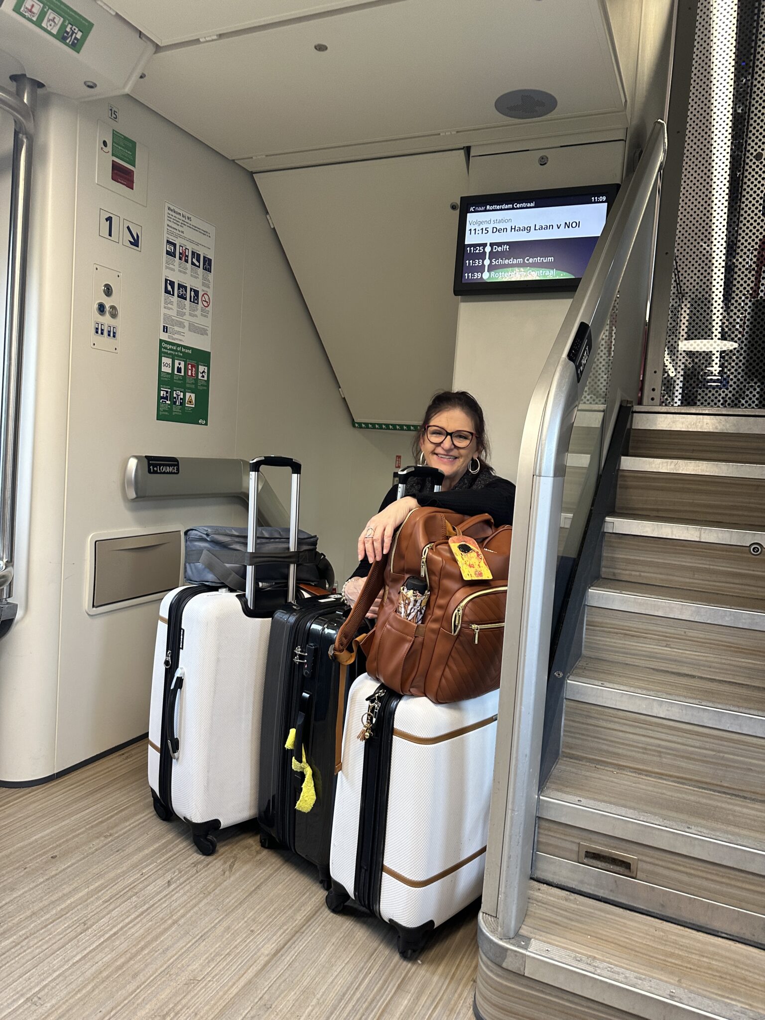 Nancy with her 24", 21" and backpack as she is traveling europe