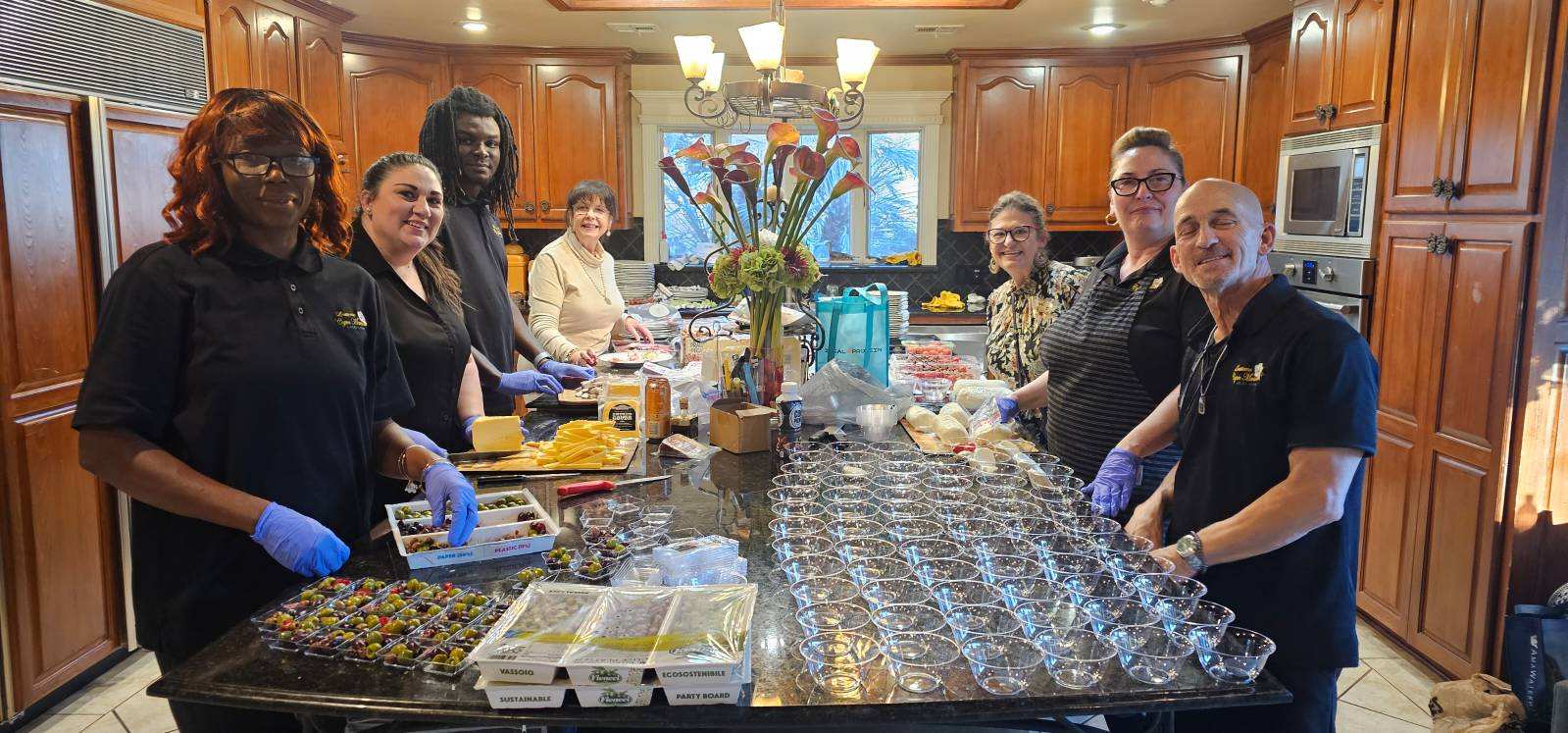 The employees in the back of house preparing for the Tuneta Torciano Wine Event