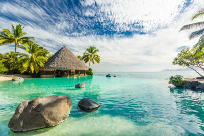 Infinity pool with palm tree rocks, Tahiti, French Polynesia